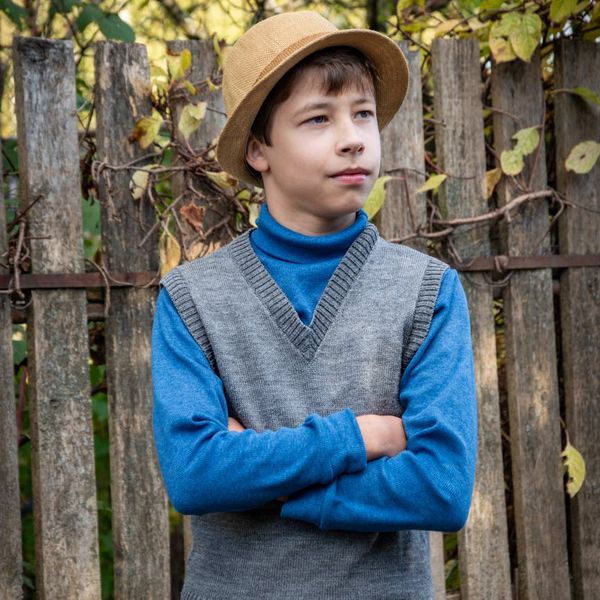 Person looking thoughtfully at a natural landscape, feeling calm.